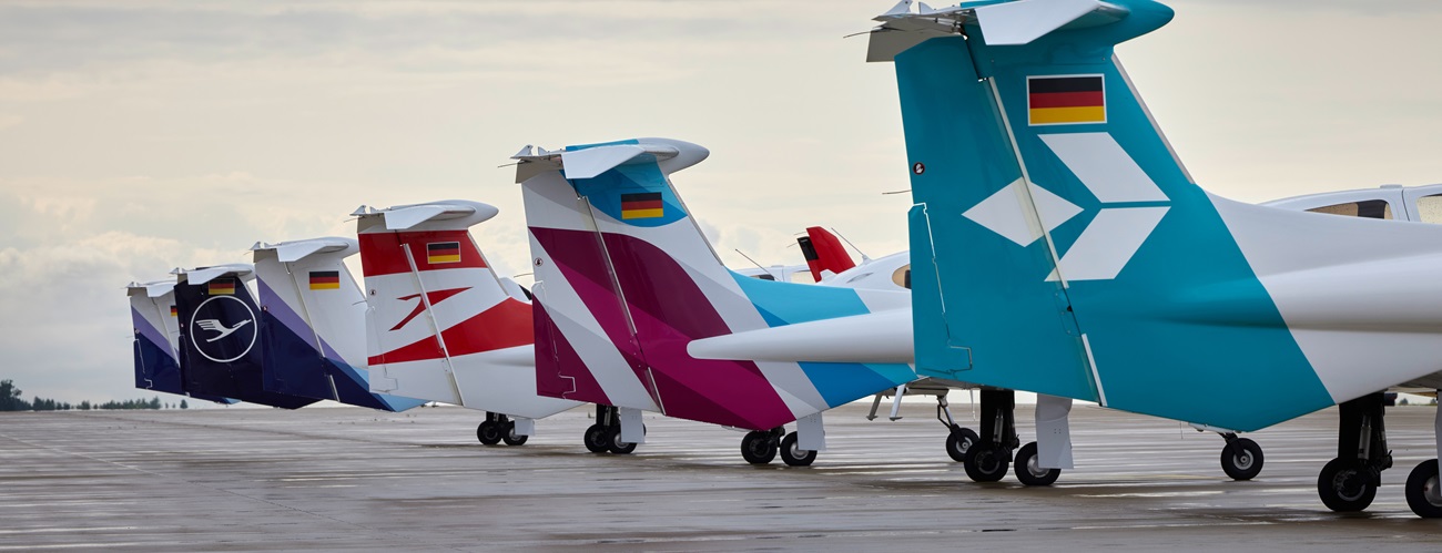 A flight student is inspecting a DA42.