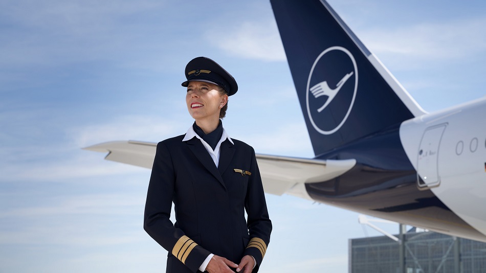 A senior first officer stands in front of an Airbus A350.